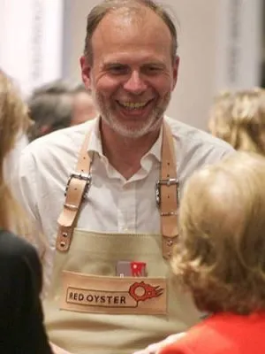 Founder Matijn Wijn wearing the Red Oyster apron at an event